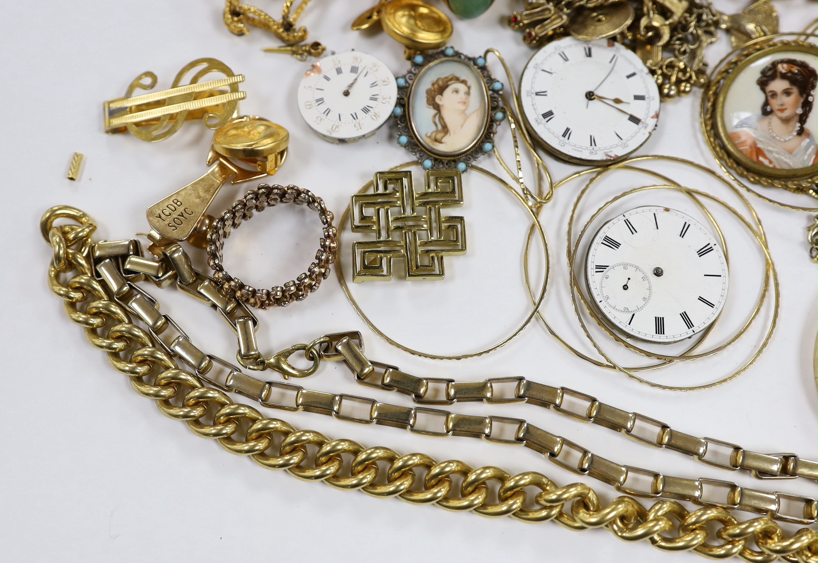 A small quantity of assorted gilt metal or gold plated jewellery, including large cub link necklace, bangles, bracelets, rings, cufflinks etc and three pocket watch movements.